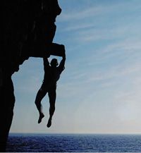 Guy hanging from a Cliff for Traffic Drop Audit Checklist